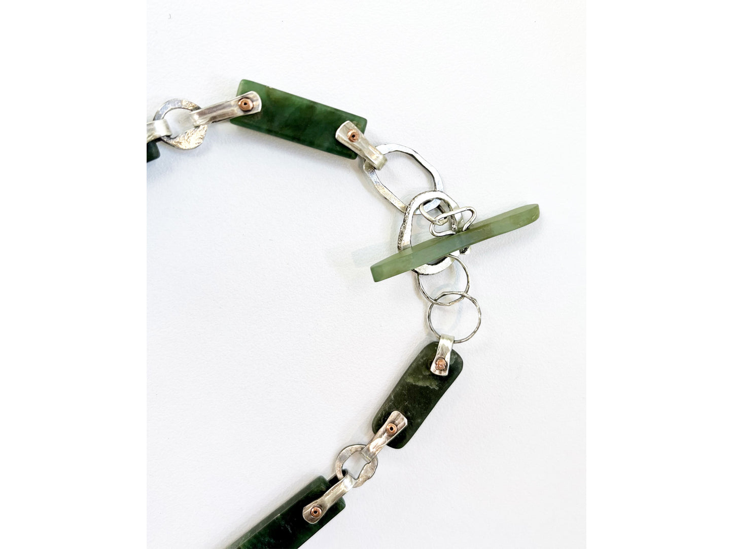 Silver necklace with jade bars and copper rivets