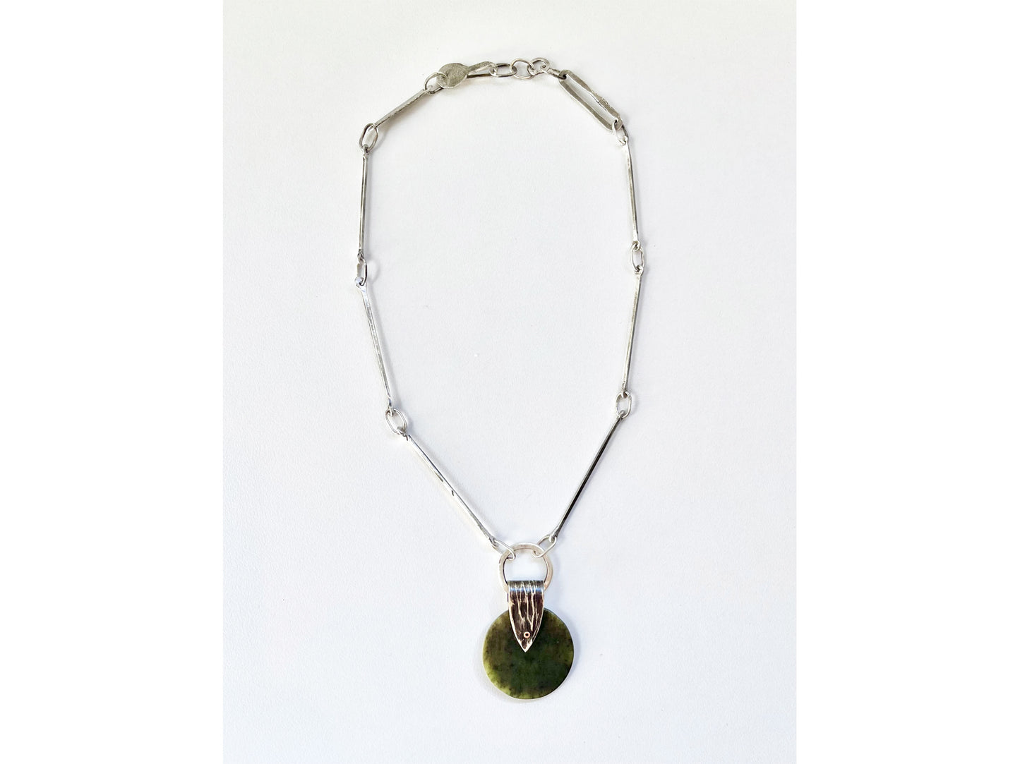 Silver chain with round jade pendant