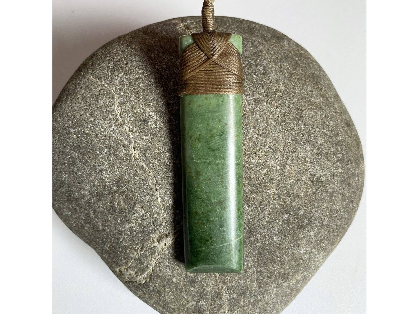 Hei Toki Kawakawa Pounamu Pendant (brown cord)