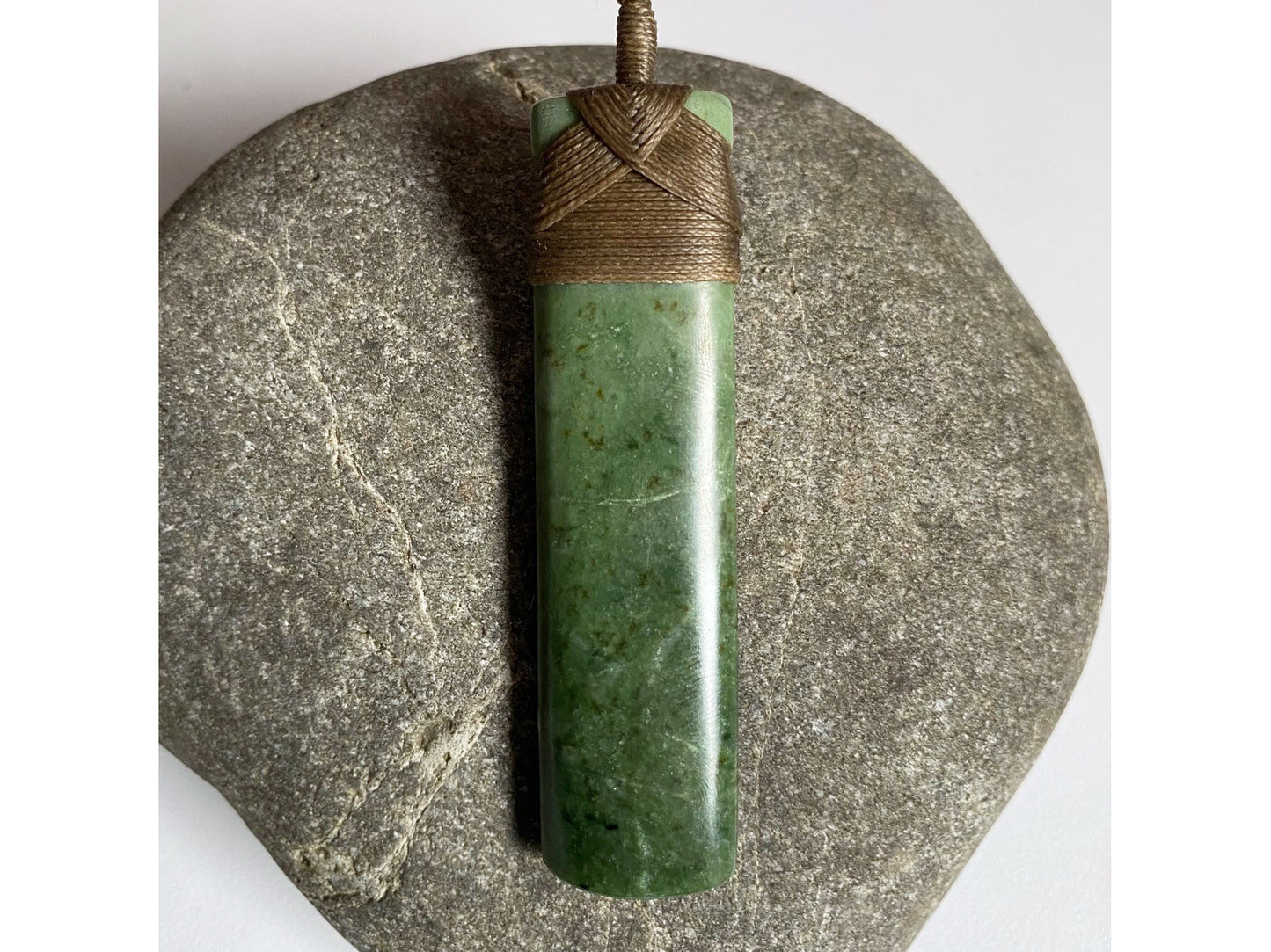 Hei Toki Kawakawa Pounamu Pendant (brown cord)